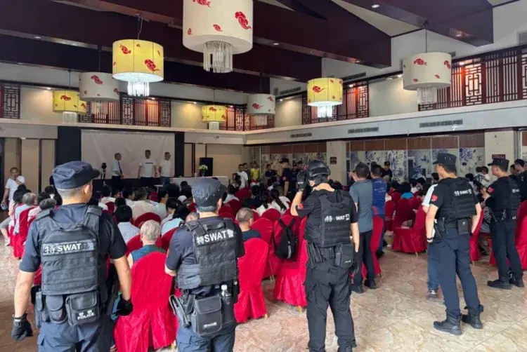 This screenshot of a video taken by a congregant and posted on Telegram shows Chinese government personnel during their raid on the Early Rain Covenan...