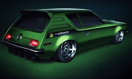 A smoking' photo of an AMC Gremlin from 1985 with the words "the grinch" tattooed on its side, forest green for sex appeal.