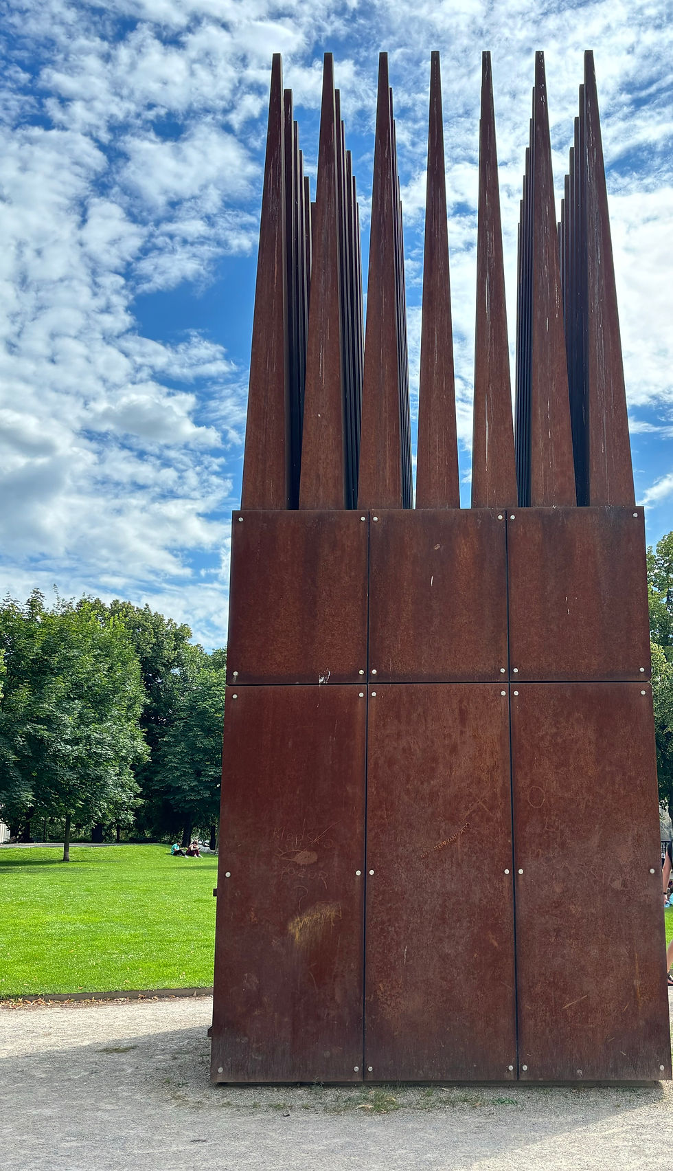 Two sculptures called the House of the Suicide and The House of the Mother of the Suicide along the river bans of the River Vltava