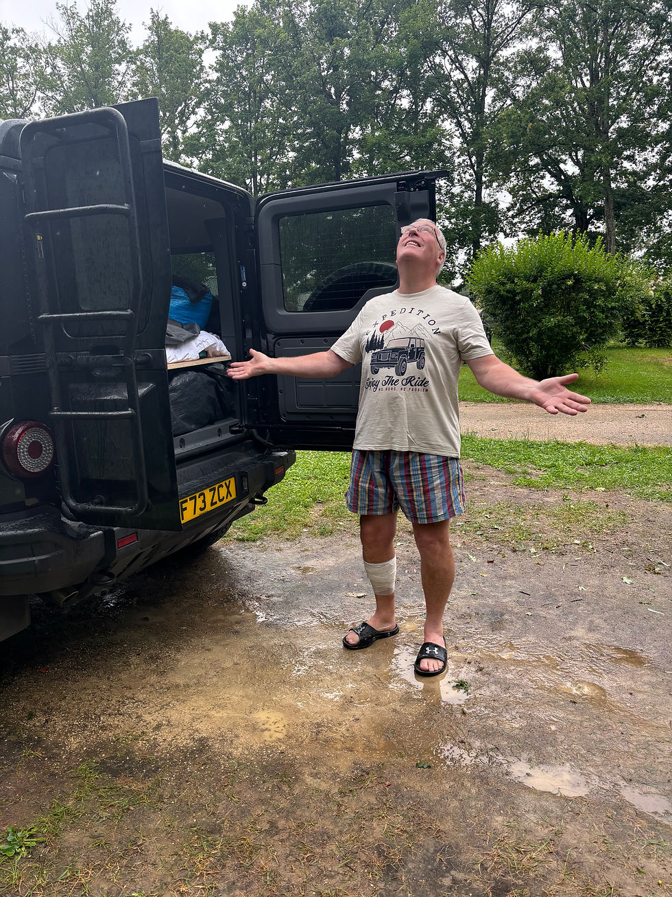 Michael hoping the rain stays off long enough to get the tent up