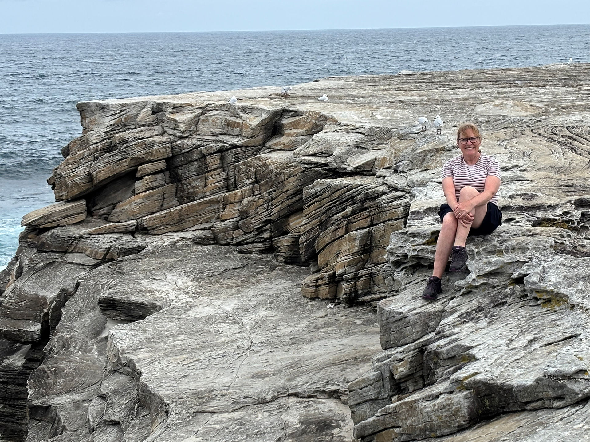 Coogee to Bondi Walk Karen sitting on the rocks