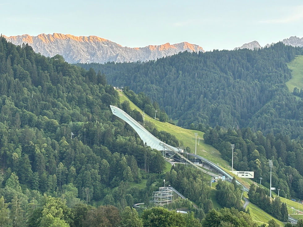 The mountains turning orange sets off the 1936 olympic ski jump perfectly