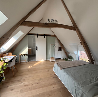 A double bed in the bedroom ensuite