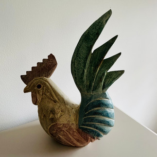 Chickens and Roosters were living outside and inside as ornaments