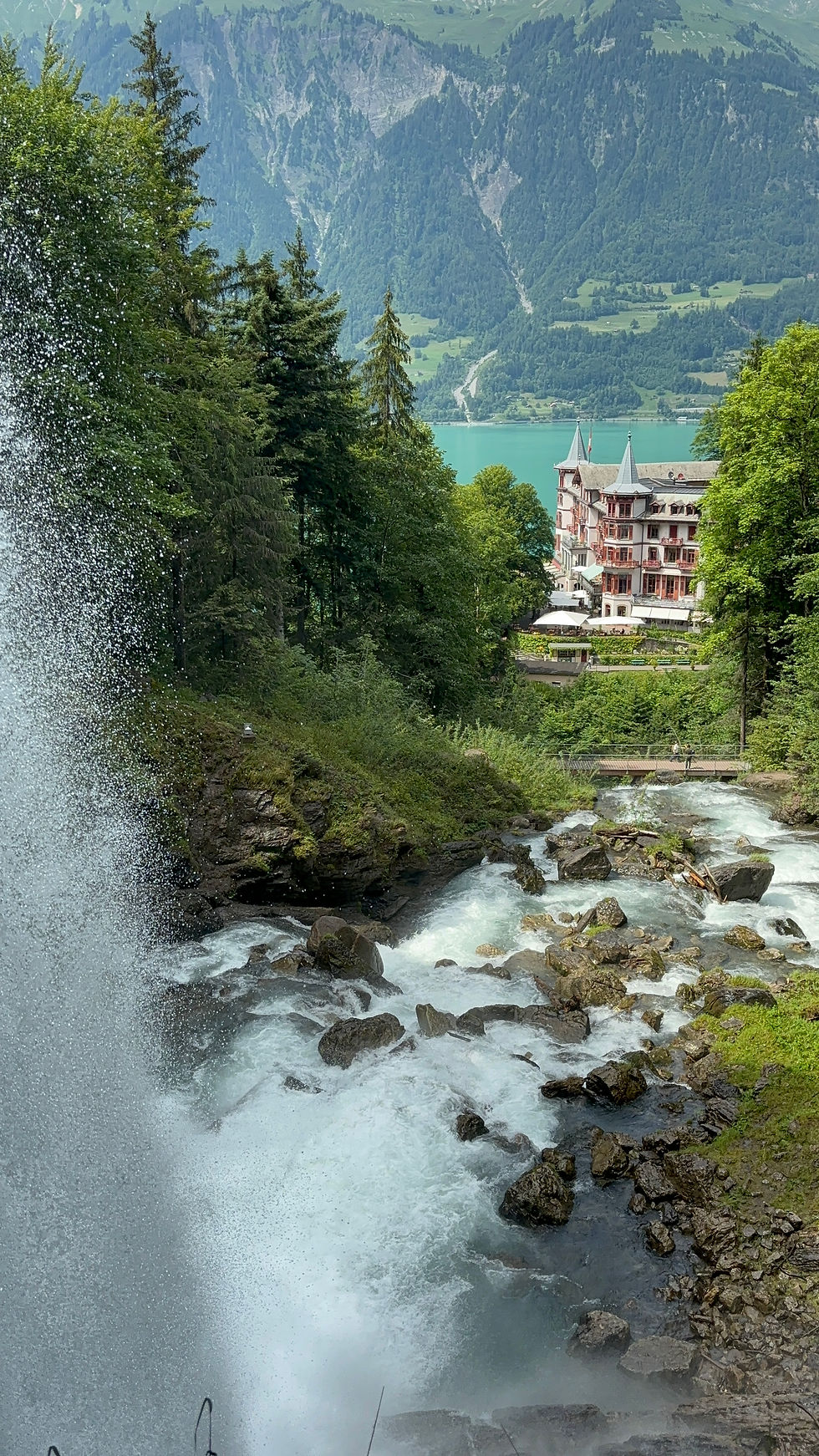 the picturesque GeissbachHotel and turquoise water of Lake Brienz