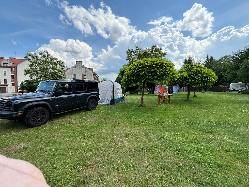 our Grenadier set up with our awning tent and washing on our rigged washing line.