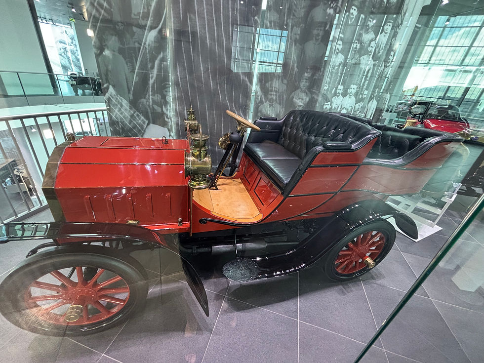 The first Horch car is in a display cabinet and is the start of the tour around the museum