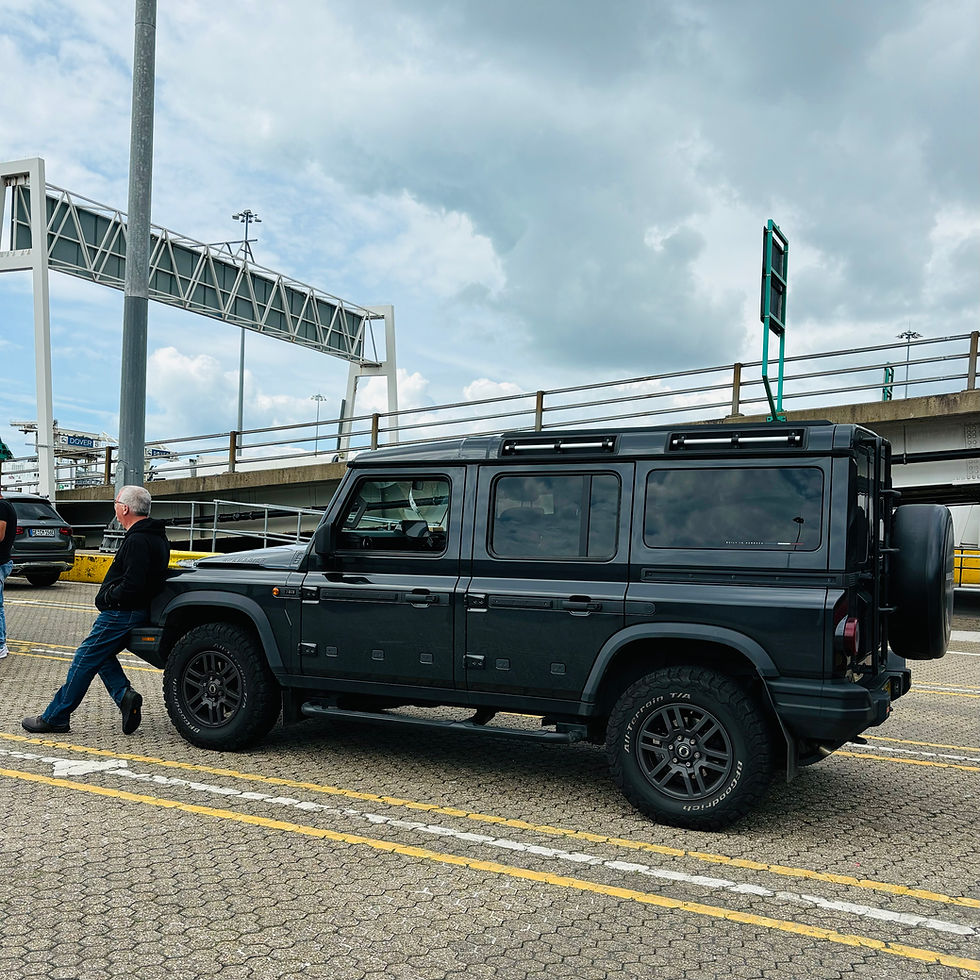 Michael resting on the bumper of our Grenadier