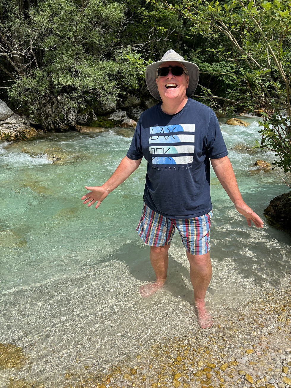 Michael dipping his feet in the water