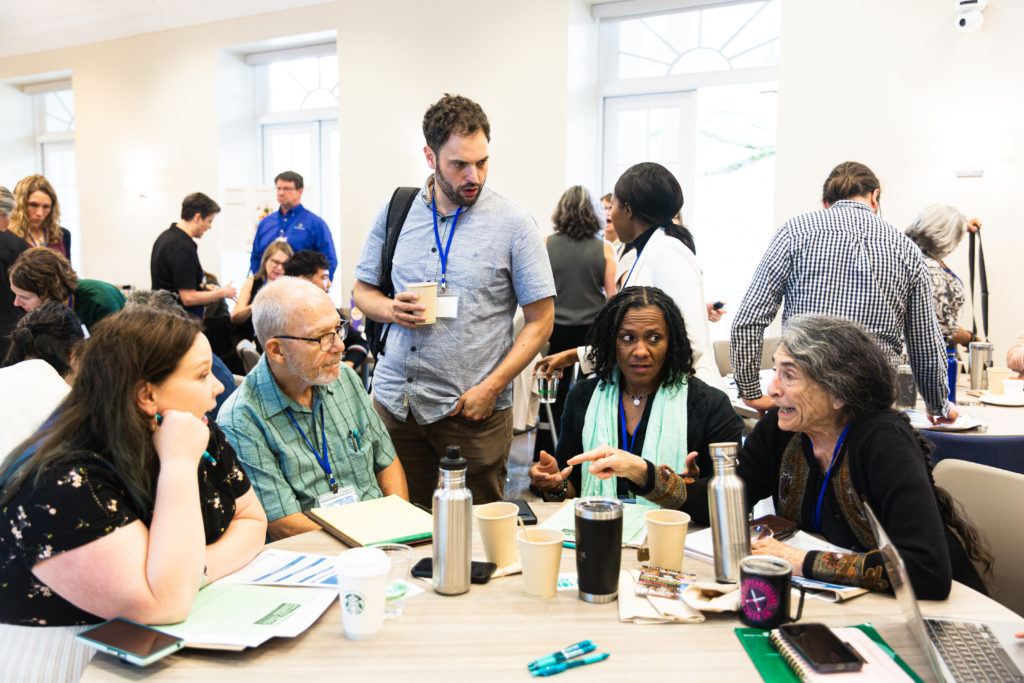 Members of the Buffalo Food Policy Council check in during the networking breakfast.