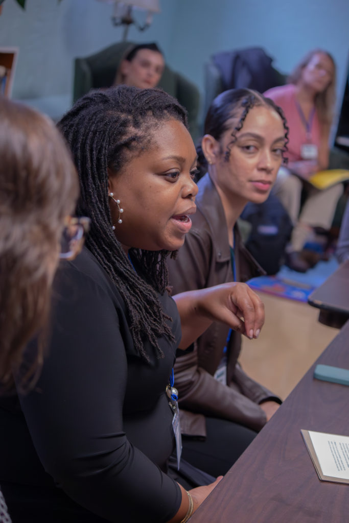 Brittany Taylor shares about her perspective on how to reframe our conversations about food and health while Arlaina Harris looks on. (Credit: So Nishitani)