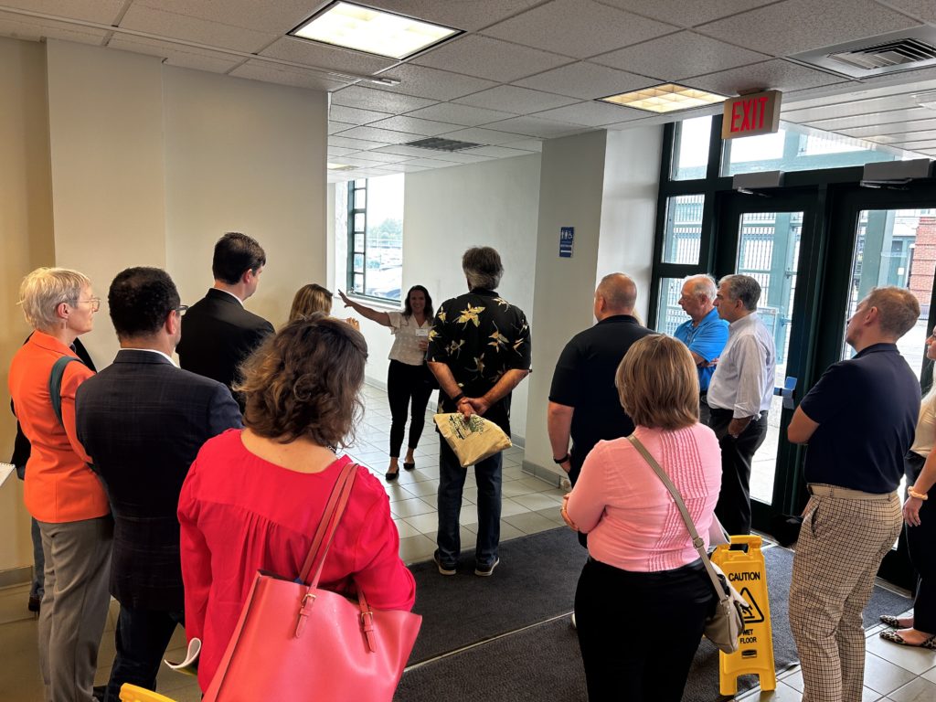 Executive Director Amanda Vitale discusses the history of the Market and shows off the gallery in the Administrative Building hallway.