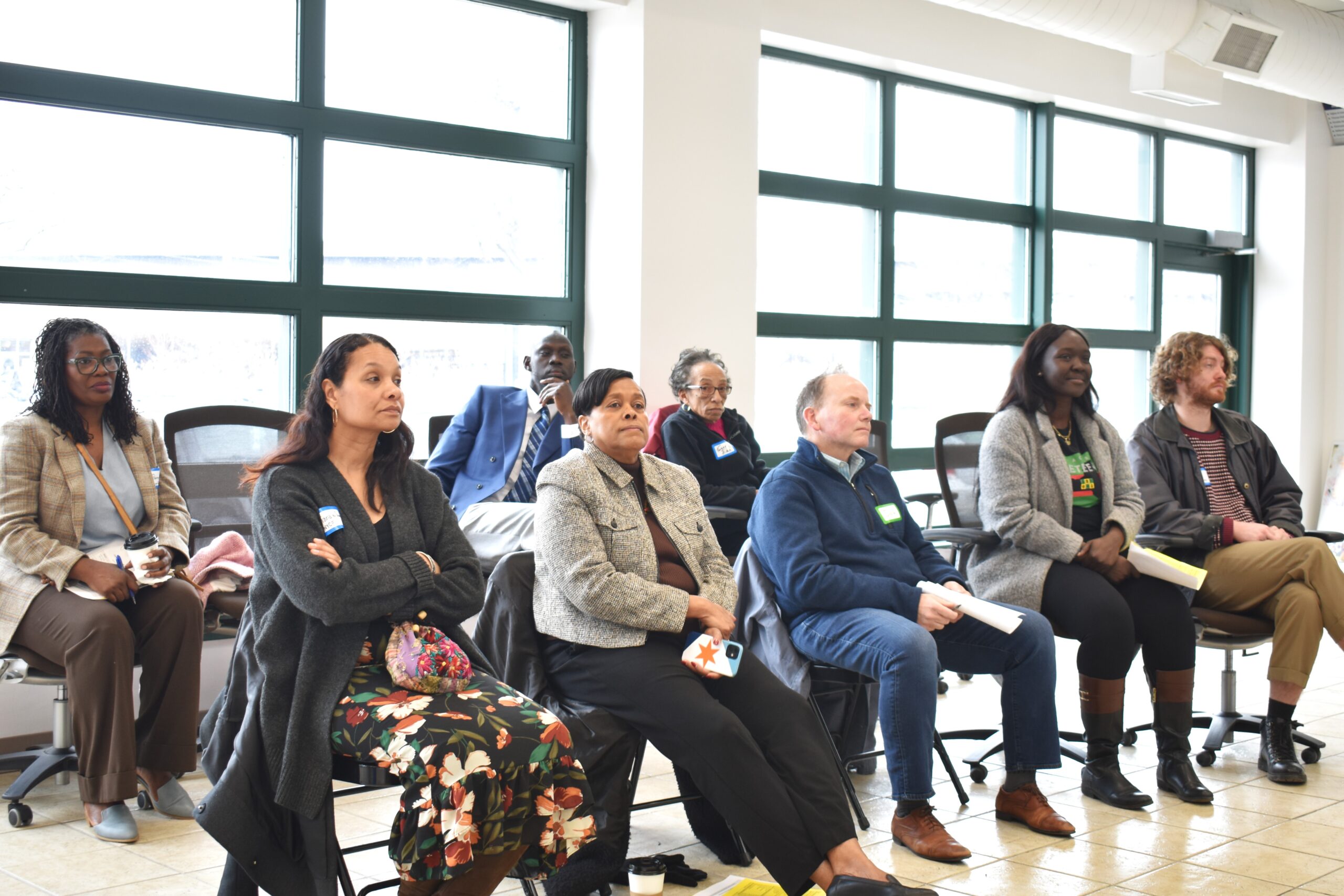 People sit and listen attentively