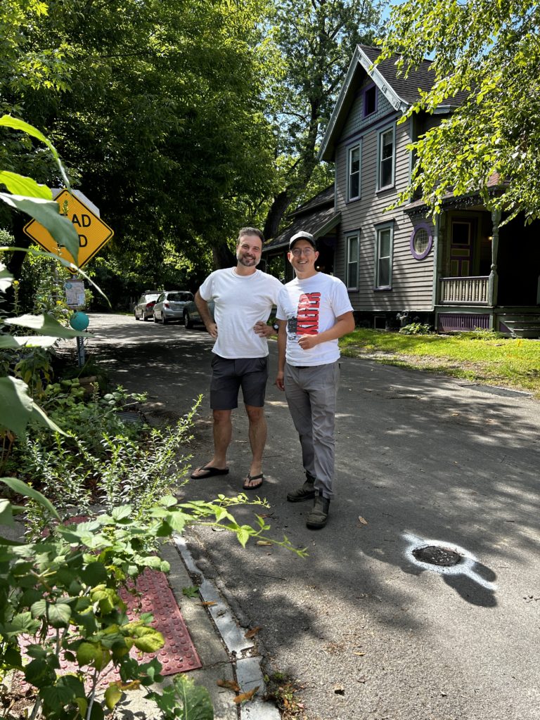 Frank and Jacob pose for a photo outside the Bitternut Homestead Collective.