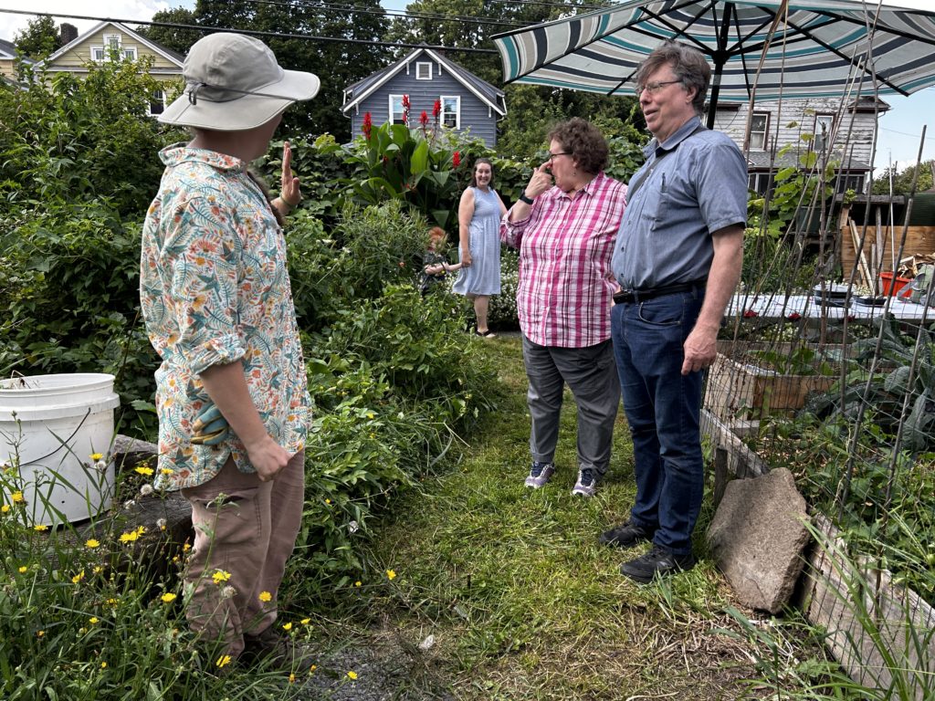 Heather shows off her perennial garden and homemade deer fence.