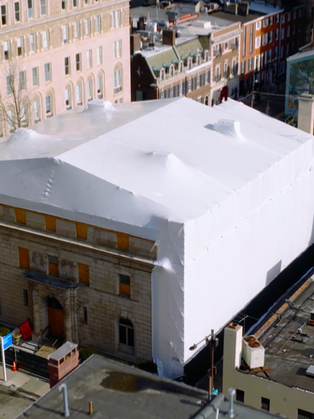 Completed temporary scaffold and dome enclosure protecting a fire-damaged historic structure in Philadelphia.