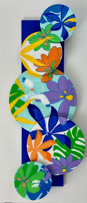 Canopy of Color interactive wall sculpture with rotating circular panels featuring an ibis family among colorful tropical leaves by MJ Dowling