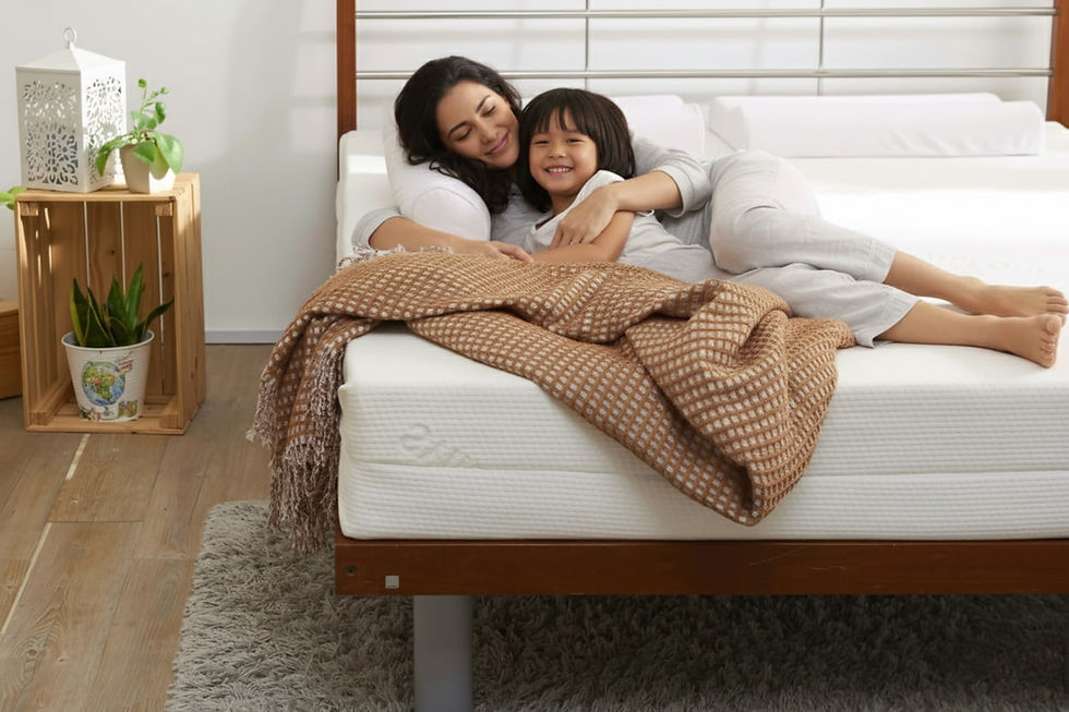 family lying down on all-natural latex mattress