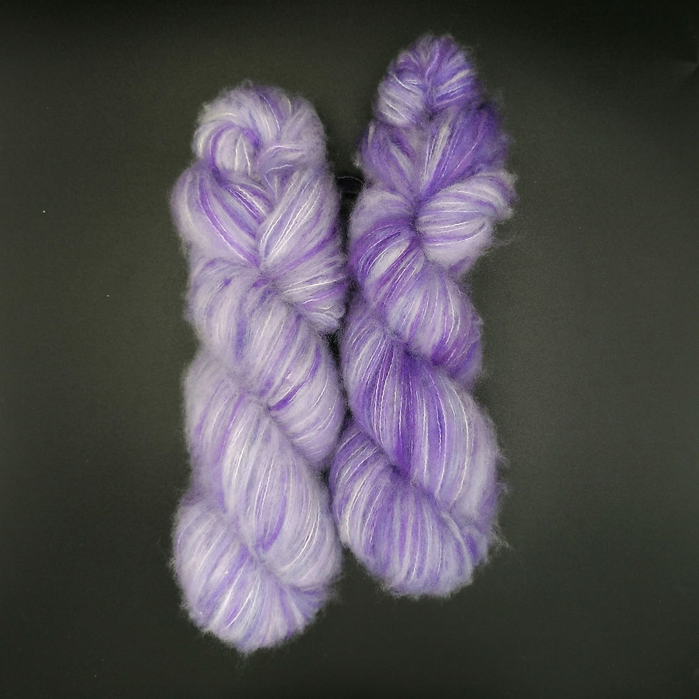 Thumbnail: Hand-dyed yarn in light and dark purple tones on a brushed merino and nylon base, named Elvira