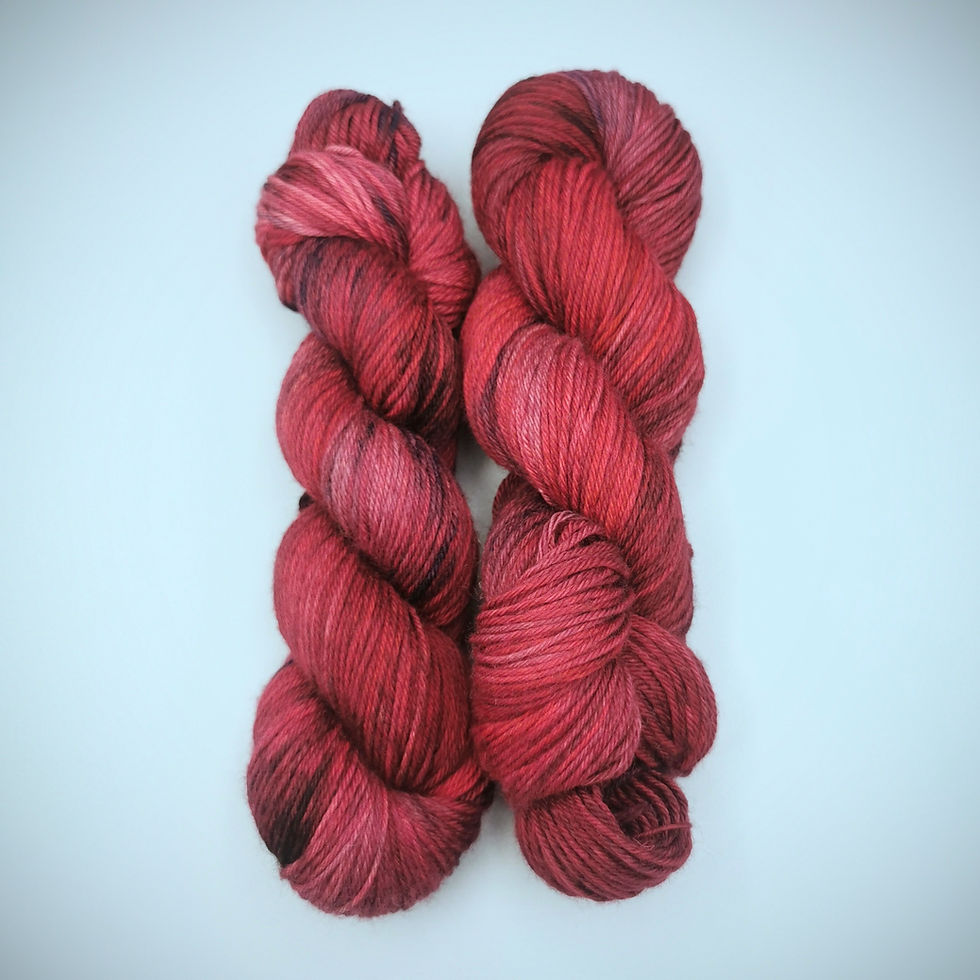 Thumbnail: Two skeins of gothic tonal yarn in deep maroon red hues by Skeinhawk Yarns