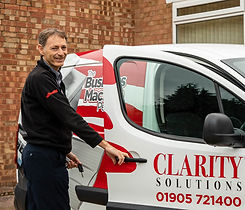 Clarity Solutions Service Director Mark Berryman getting into van