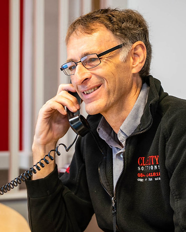 Clarity Solutions Service Director Mark Berryman on the phone