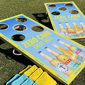 Hann XXXX Byron Bay Beer bottle cornhole game with modified rules_edited.jpg