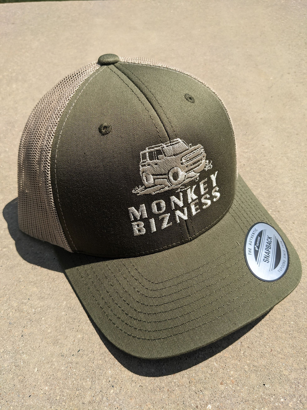 Thumbnail: Angled view of Moss and Tan trucker style hat