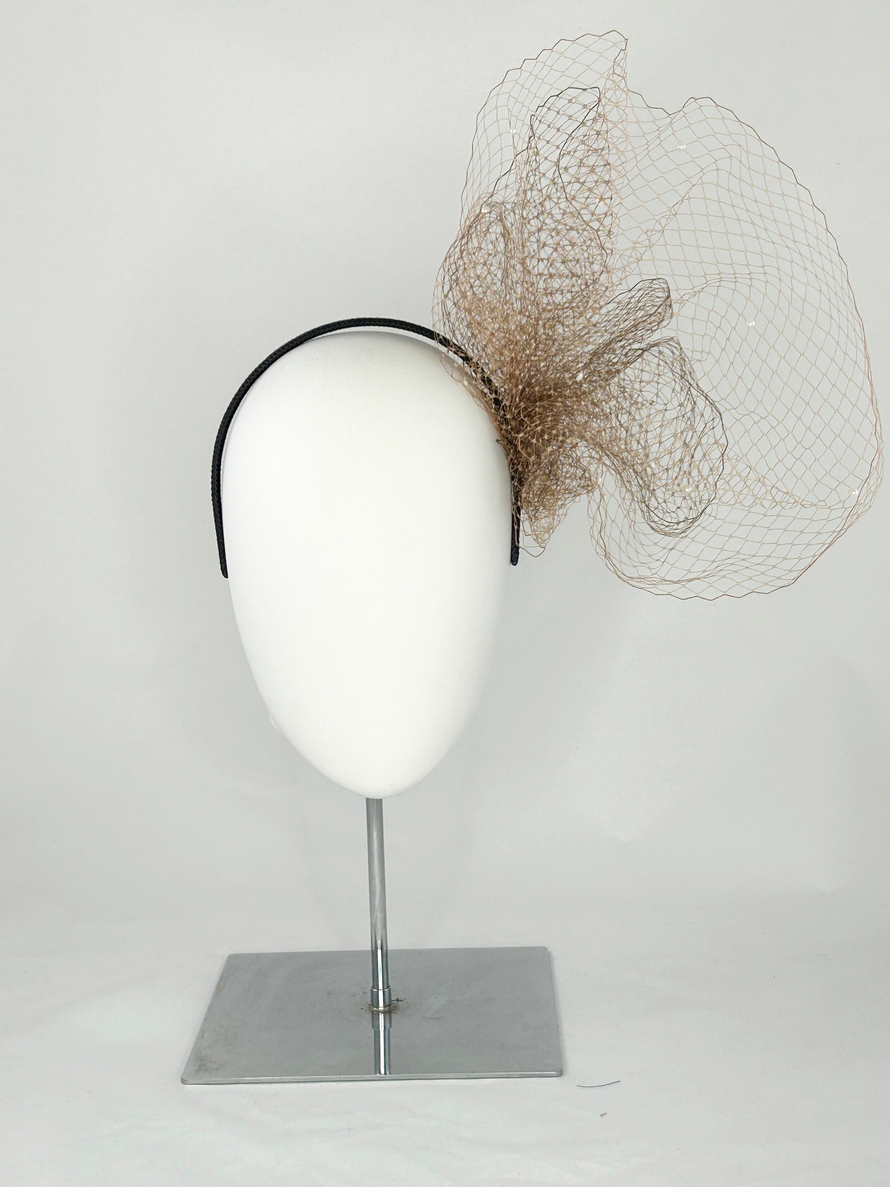 Brown veiling fascinator