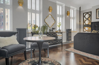 Elegant bedroom with large windows and luxurious furniture, Jry Property Group.