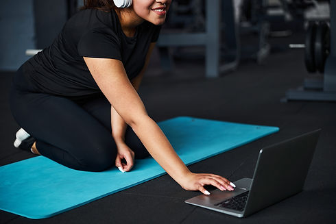 serene-female-exercising-in-gym-online-with-gadget-2021-09-03-07-04-04-utc (1).jpg