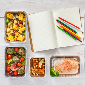 notepad and portioned meals for meal planning