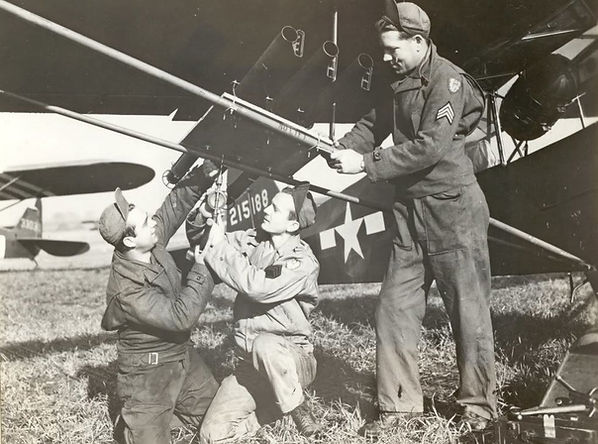 Pilots Fixing a Plane in Its Hanger