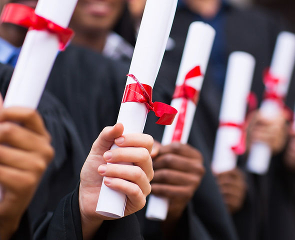Graduates Holding Diplomas_edited.jpg