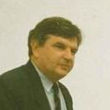 Portrait of a man in a suit and tie - Raoul Mortley