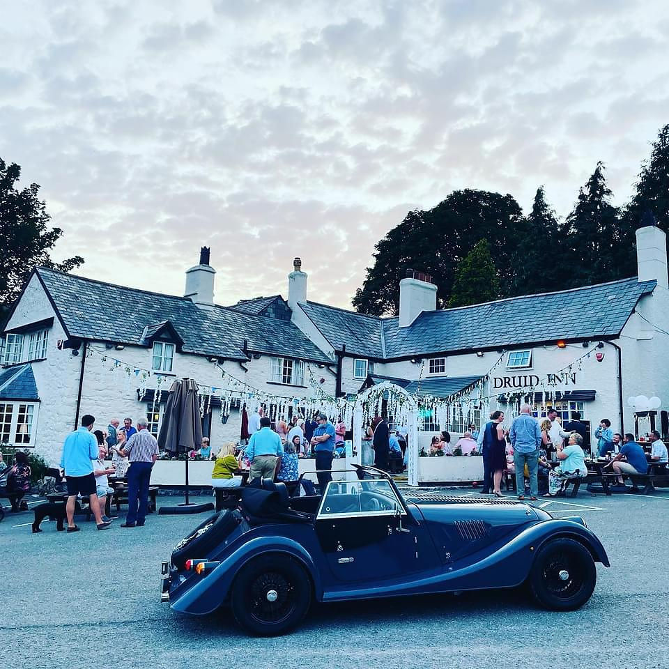 A classic car outside Druid Inn in Llanferres