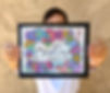 stephanie holding a coloring page with text that states "breathe'