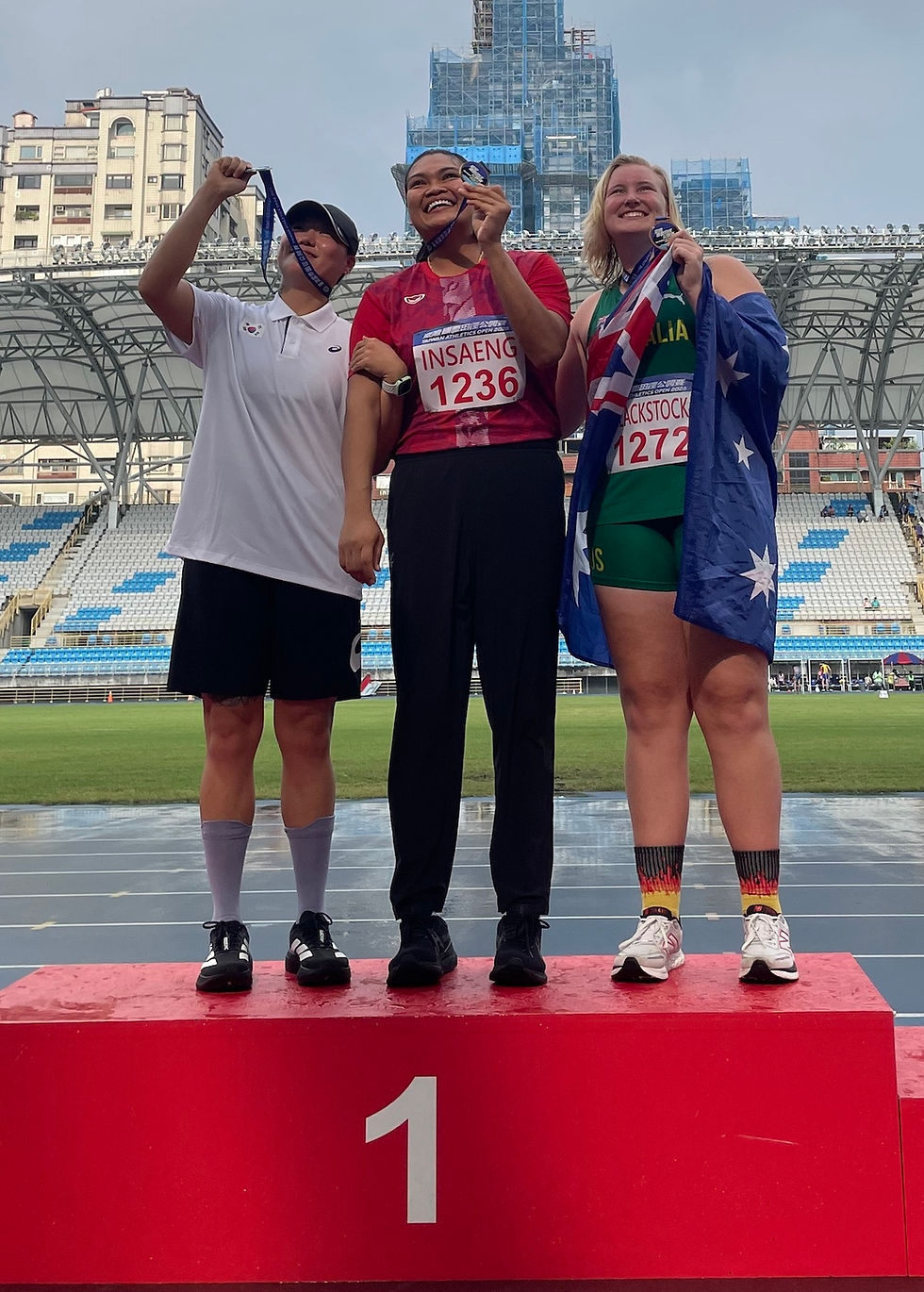Ashlyn on the victory dais after medalling at the Taiwan international meet.