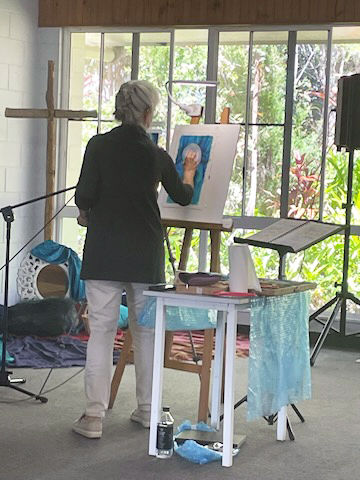 Special guest Lyn Diefenbach creates one of her artworks during the retreat.