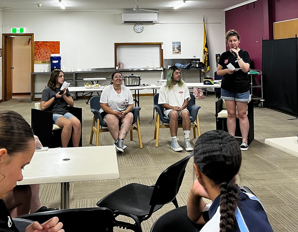 Carmen (standing) leads her ‘Carmen’s Couch’ segment at Belong Youth where she interviews some of the leaders.