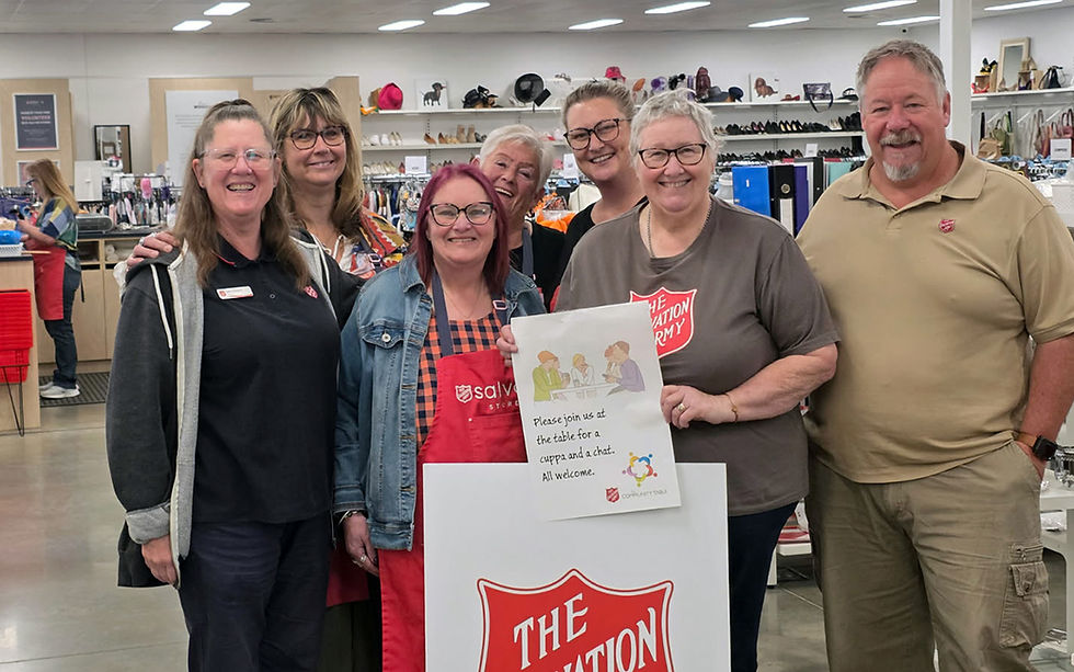 The Young Salvos Store community table group. (Back row) Kath, Fay and Narissa. (Front row) Captain Deb Parsons, Vera, Tessa and Captain Rod Parsons.