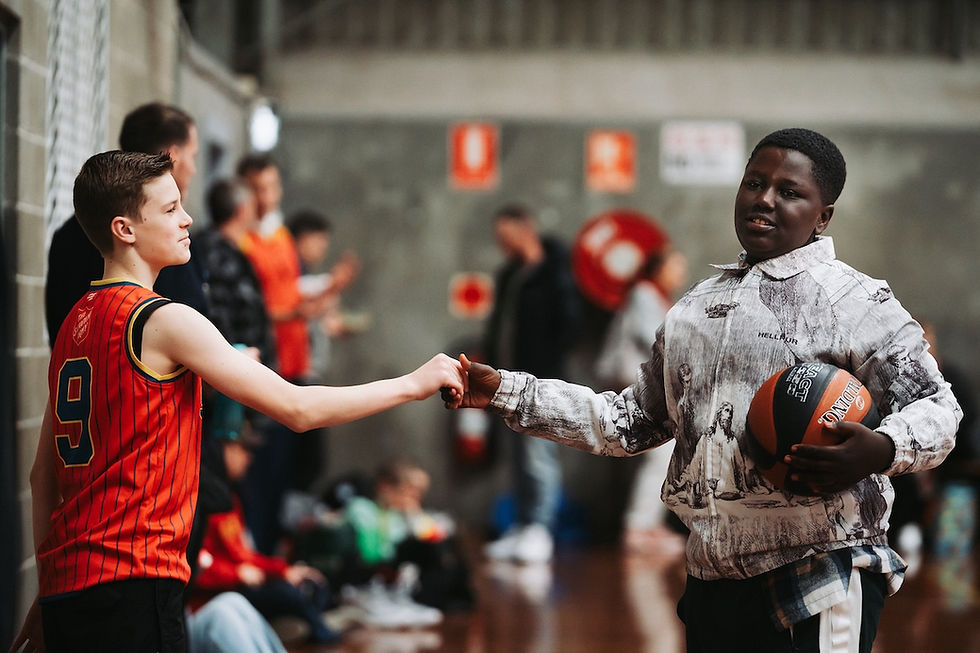 A handshake between Jed Dunkley (SA) and Serieux Rwagasore (Qld ) that reflects the camaraderie of the carnival.