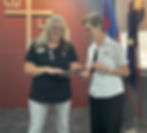 Commissioner Miriam Gluyas presents William Booth House Team Leader Traci Wilkins with a certificate marking 20 years of service to The Salvation Army.