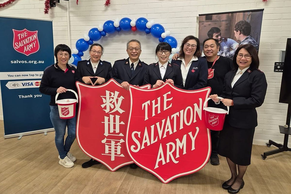Captains Dillon Wu and Rong Fu (centre) and members of the Burwood Corps celebrate their outstanding result in the 2025 Red Shield Appeal. Image: Supplied