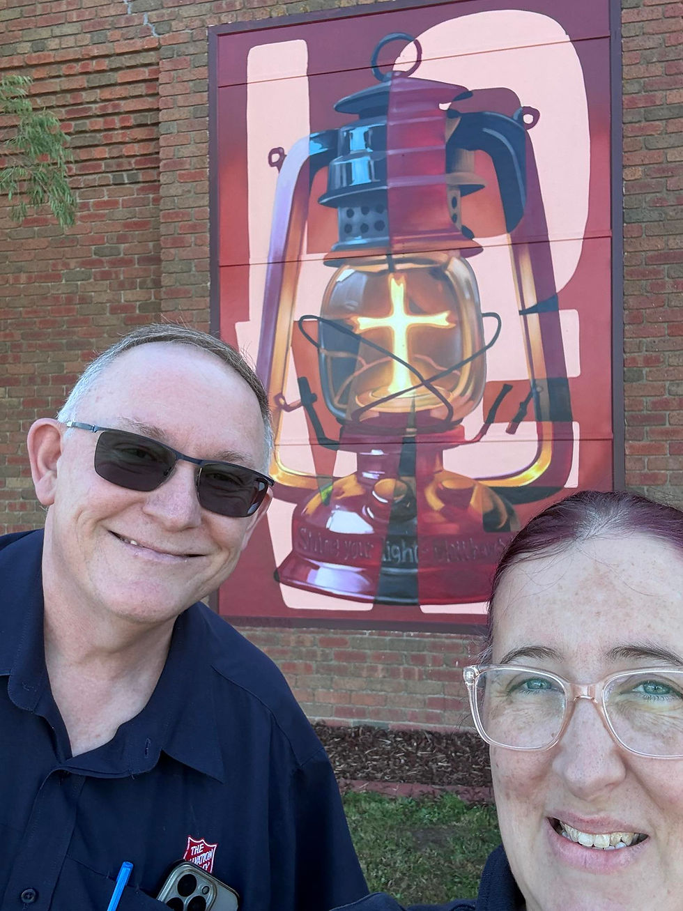 Corp Officer/Team Leaders at Greater Ballarat Salvos, Major Peter Walker (left) and Captain Amy Jones, in front of the mural that has captivated the local community.