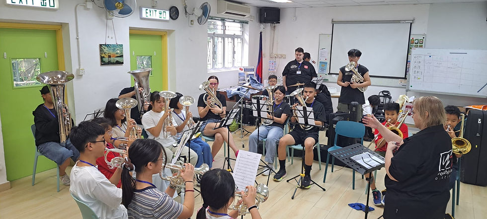 Julia Roper leads the kids band rehearsal at the Hong Kong Territorial Music Institute.