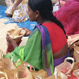 Lotus Ministry Trust Volunteer Bagging Rice