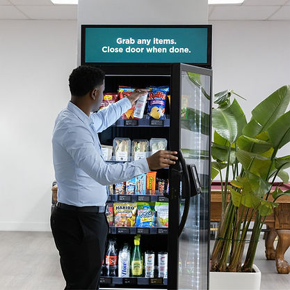 Go Bitz Vending staff restocking vending machine for local business