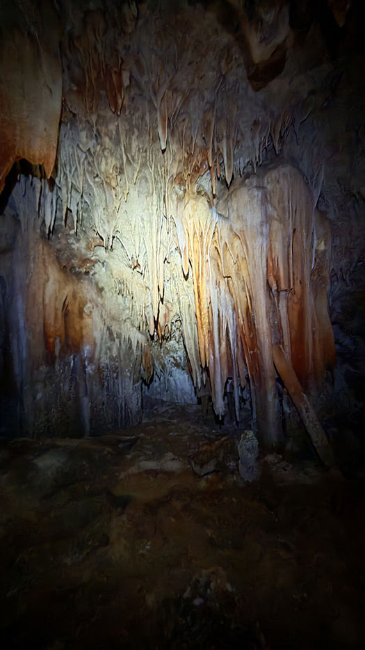 Cavers exploring Tahry Cave Oman, discovering crystal formations and limestone chambers on a 1-day adventure.