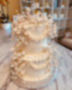 High angle view of a mirror glaze cake with vibrant colors and glossy finish